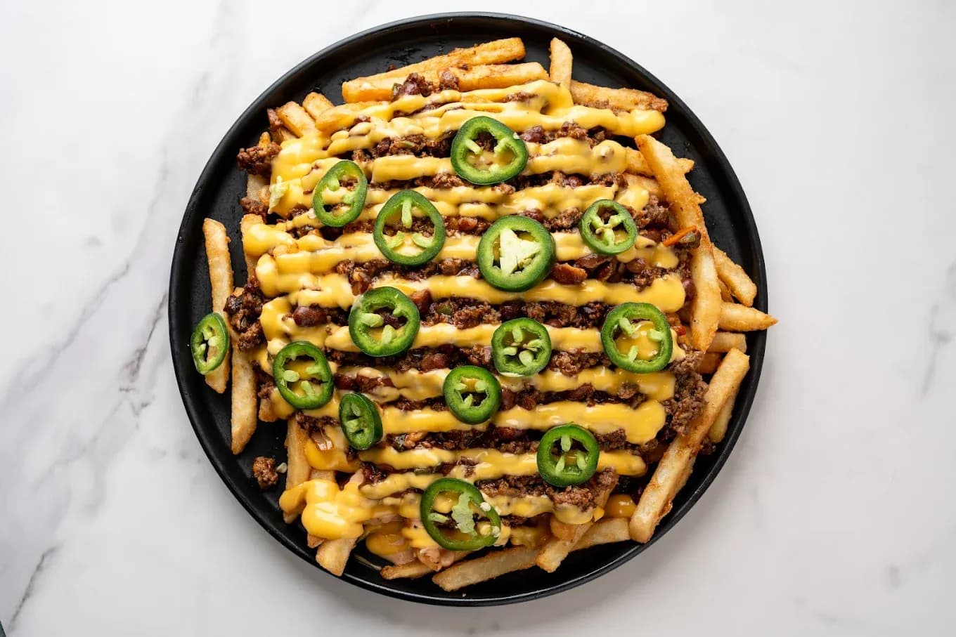 Chili Lava Fries in Dallas TX - Juicy Joint